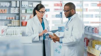 Pharmacists conversing | Image credit: Gorodenkoff – stock.adobe.com