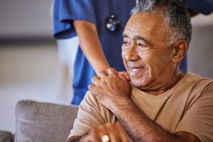 Senior elderly older man smiling with nurse | Image credit: Beaunitta Van Wyk:peopleimages.com - stock.adobe.com