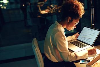 Woman working late at her desk | Image Credit: A.B./peopleimages.com - stock.adobe.com