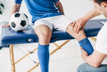 Partial view of Physiotherapist massaging leg of football player in hospital | Image credit: LIGHTFIELD STUDIOS - stock.adobe.com