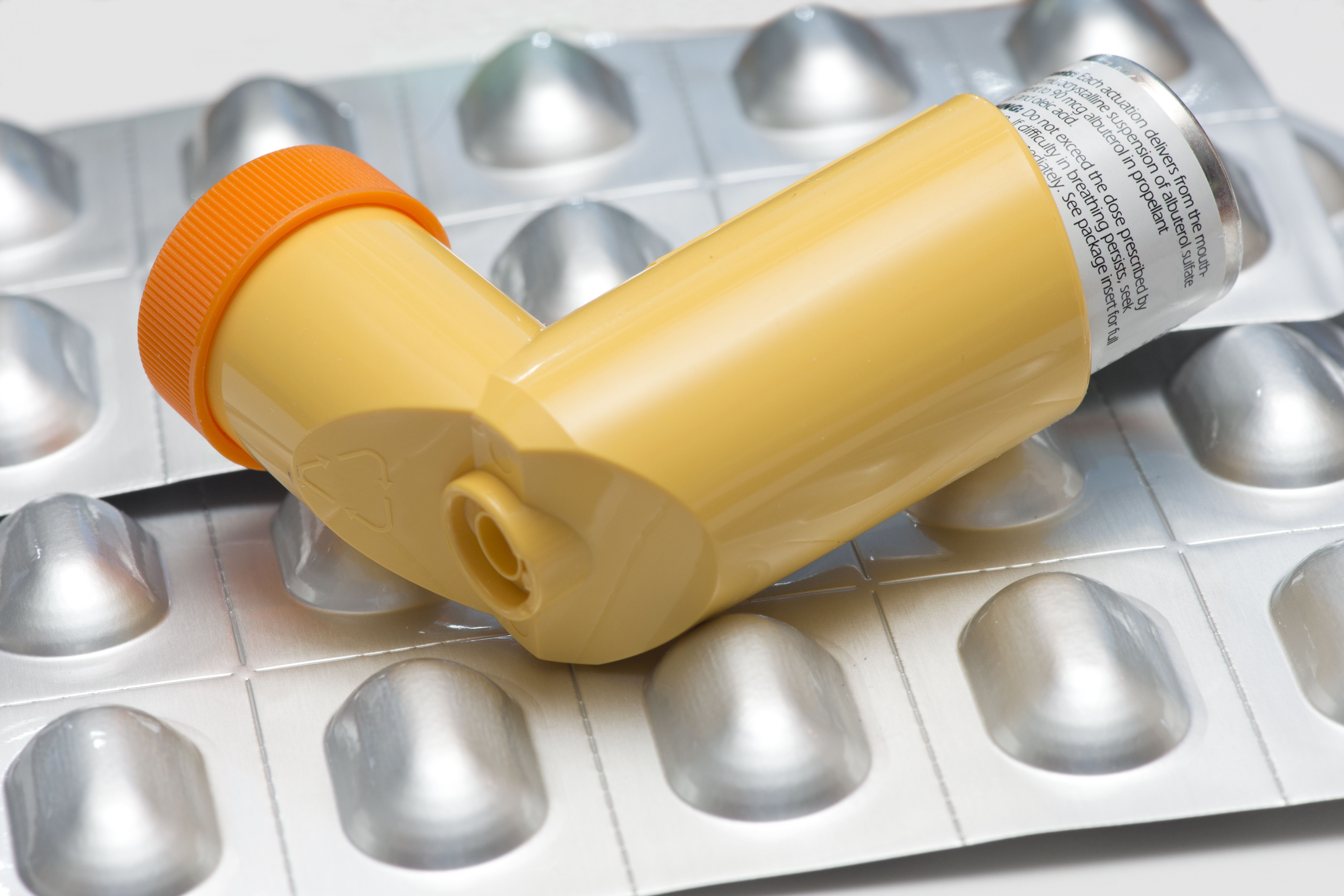 inhaler sitting on a pill pack