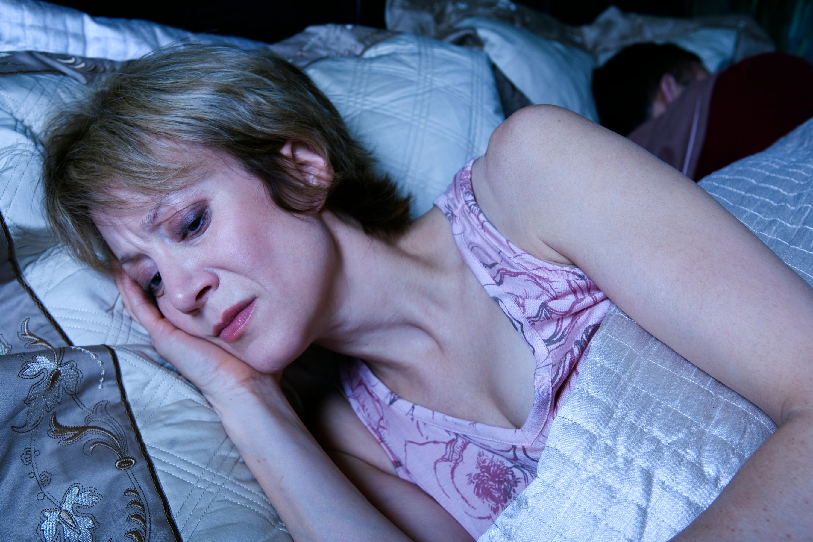 Woman awake in bed