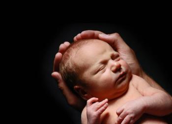 baby held in hands