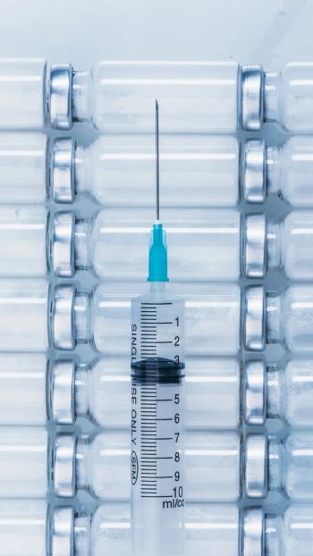 Medicine, Injection, vaccine and disposable syringe, drug concept. Sterile vial medical syringe needle. Glass medical ampoule vial for injection. | Image Credit: © ivandanru - Stock.Adobe.com