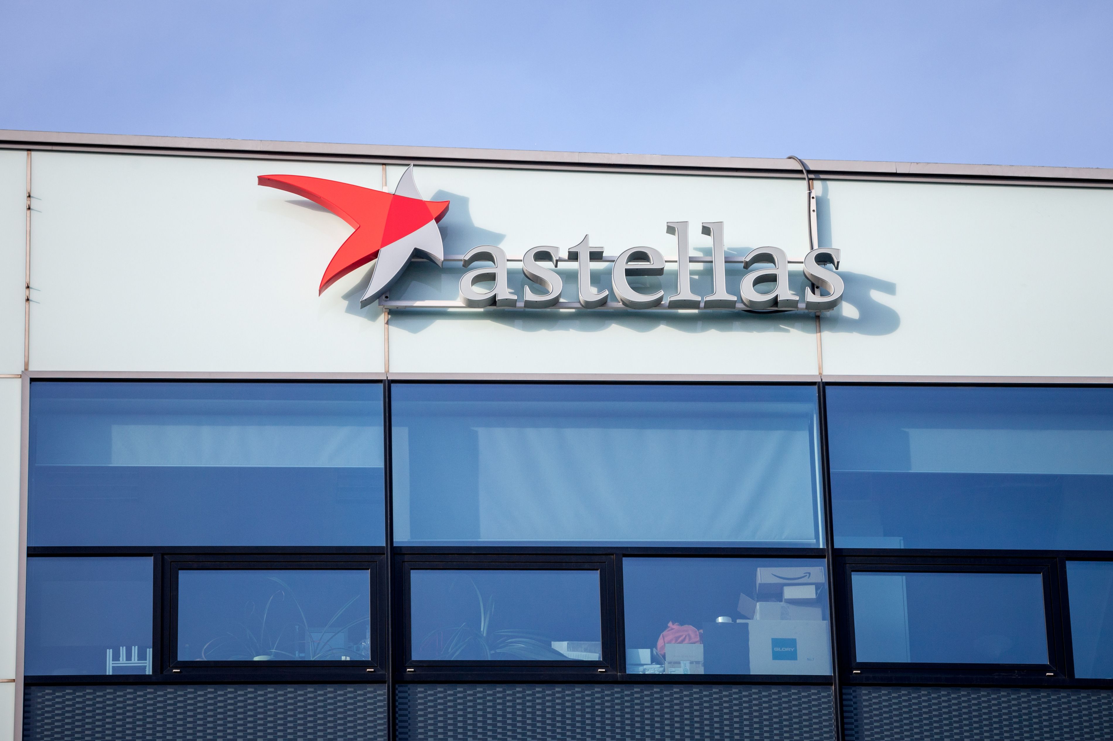 PRAGUE, CZECHIA - NOVEMBER 1, 2019: Astellas logo in front of their main office for Prague. Astellas Pharma is a Japanese Pharmaceutical company spread worldwide | Image Credit: © Jerome - stock.adobe.com