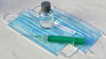 Racamani/Stock.adobe.com - image of vial and syringe with facemasks