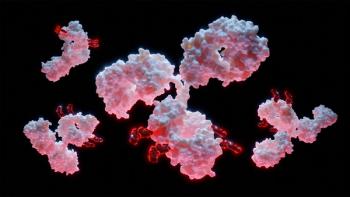 Multiple antibody molecules with small red payload fragments attached, on a black background. | Image Credit: © Alpha Tauri 3D - stock.adobe.com