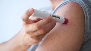 an anonymous adult man injecting himself a treatment such as insulin or Adalimumab, Etanercept or epinephrine into his shoulder. It is a white pen injector with red head for health care | Image credit: © LaMorenita - © LaMorenita - stock.adobe.com