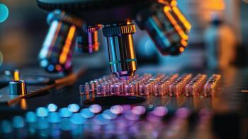 Close-up of a microscope lens examining microarray slides, a crucial tool in genomic research and medical diagnostics | Image Credit: © Varunee - Stock.Adobe.com