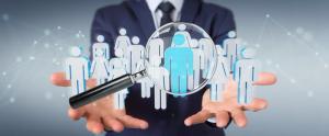 Businessman using magnifying glass to recruit people 3D rendering | Image Credit: © sdecoret - stock.adobe.com