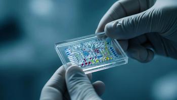 A skilled technician examines a microfluidic device in a laboratory setting. | Image credit: © Vectplus - © Vectplus - stock.adobe.com