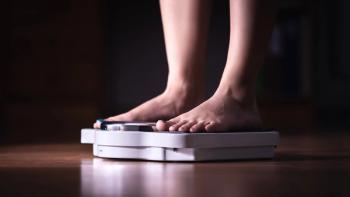 Feet on scale. Weight loss and diet concept. Woman weighing herself. Fitness lady dieting. Weightloss and dietetics. Dark late night mood. | Image credit: © terovesalainen - © terovesalainen - stock.adobe.com