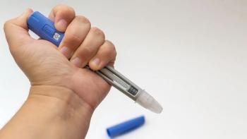 Hand Holding Medical Injection Pen on White Background, isolated, copy space | Image credit: © Yulia Antonova - © Yulia Antonova - adobe.stock.com