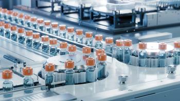 Vaccine Production Facility. Medication Manufacturing Process. Glass Vials with Orange Caps on Conveyor Belt. Medical Ampoule Production Line at Modern Pharmaceutical Factory. | Image Credit: © IM Imagery – © IM Imagery– Stock.Adobe.com