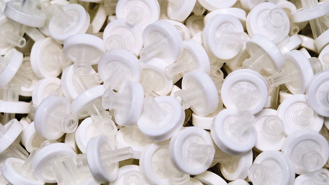 White syringe membrane filters for filtration samples before high performance liquid or gas chromatography or for microbiological analysis. Scientific laboratory tools | Image Credit: ©vladim_ka -stock.adobe.com