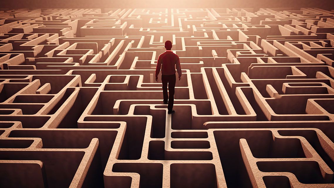 A maze with a human figure navigating through it, displayed against a challenging, problem-solving background, concept of Complexity, created with Generative AI technology | Image credit: © koldunova - stock.adobe.com