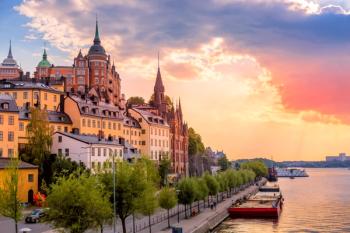Stockholm, Sweden. Scenic summer sunset view with colorful sky of the Old Town architecture in Sodermalm district. | Image Credit: © Nikolay N. Antonov - stock.adobe.com
