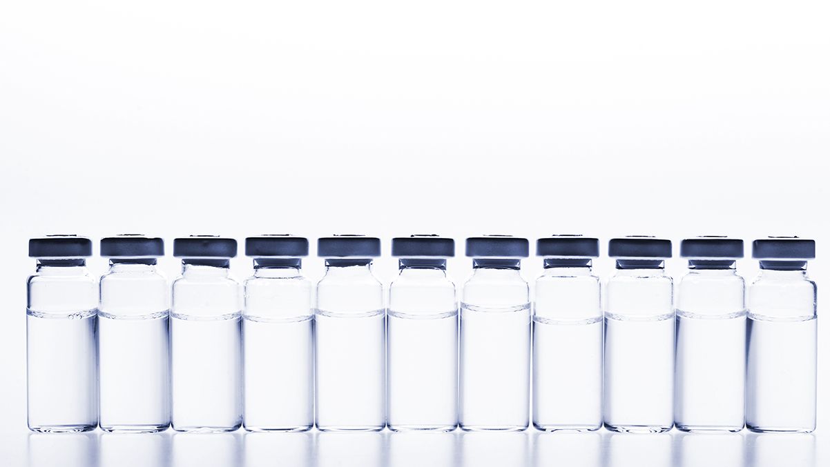 nikilitov/Stock.Adobe.com–illustrative of vials lined up for final product inspection before being packaged
