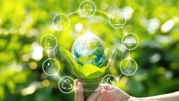 Hand holding light bulb against nature on green leaves with icons energy sources for renewable, sustainable development. Ecology concept. | Image Credit: © ipopba – stock.adobe.com