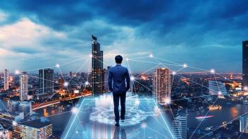 Business man on future network city | Image credit: © Peera - © Peera - stock.adobe.com 