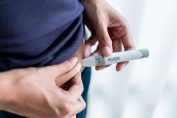 Close-up photograph of a woman administering a subcutaneous injection to her abdomen. | Image Credit: © BJ Day Stock - stock.adobe.com