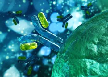 3D illustration of blue Y-shaped antibodies with glowing yellow-green capsules attached to their arms, floating near the textured surface of a large green cell against a blurred blue background. | Image Credit: © ustas - stock.adobe.com