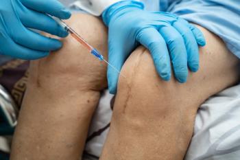Doctor administering an injection into a patient's knee. | Image Credit: ©amazing studio - stock.adobe.com