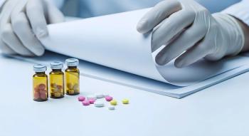 Scientist Examining Medical Documents Near Ampoules and Pills | Image Credit: ©PixelPulse-stock.adobe.com