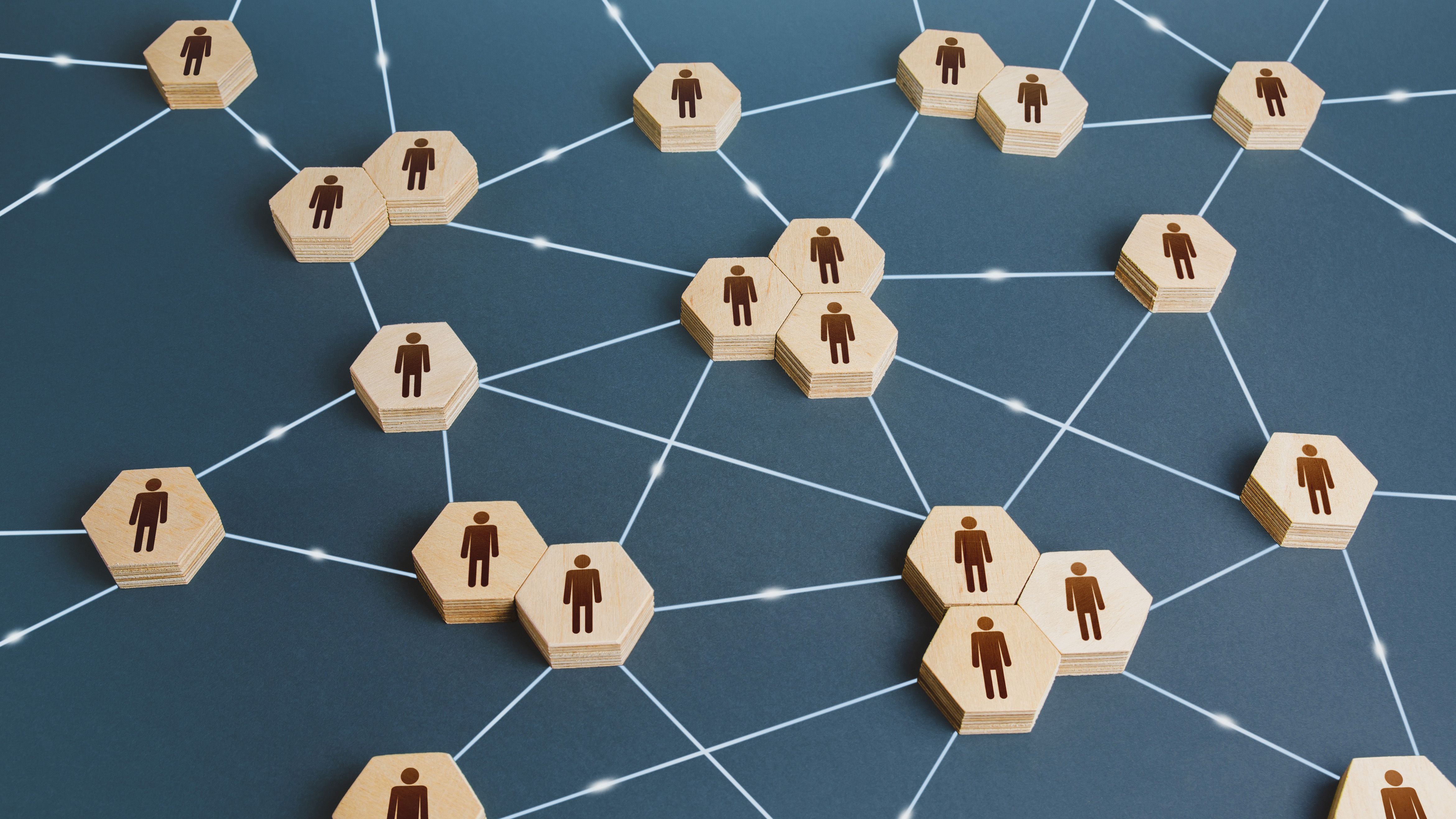 Network of interconnected people. Interactions between employees and working groups. Social business connections. Networking communication. Decentralized hierarchical system of company. Organization | Image credit: © Andrii Yalanskyi - © Andrii Yalanskyi - stock.adobe.com