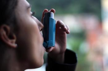 A person using a metered-dose inhaler. | Image Credit: © DALU11 - stock.adobe.com
