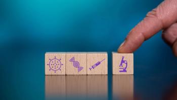 thodonal/Stock.Adobe.com - conceptual image of a hand pushing building blocks, each block containing a symbol representing areas of science research