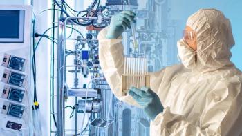 Grispb/Stock.Adobe.com – image of pharma technician assessing test tubes of inoculated cell cultures with bioreactor in background.