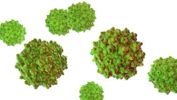 Multiple green adeno-associated virus capsid particles on a white background. | Image Credit: © Mr_Microbe - stock.adobe.com