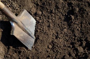 Old rusty shovel in the ground on the building | Image Credit: © photolink - stock.adobe.com