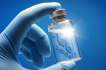 Doctor or scientist shows a vial of genetic agent as a vaccine or therapy against Corona or Covid-19 as a symbolic image | Image Credit: © Dan Race - stock.adobe.com