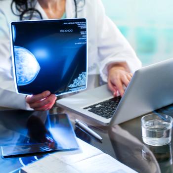 doctor looking at mammogram