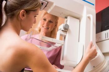 woman receiving mammogram