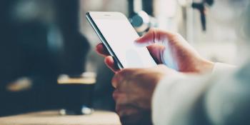 Doctor uses a smart phone 