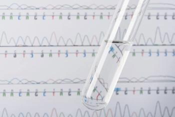 Test tube with transparent liquid and DNA chromatogram on background | Image Credit: © nevodka.com - stock.adobe.com