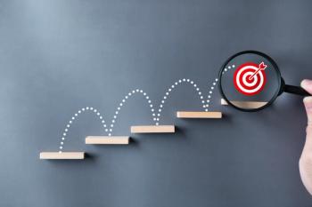 Unlock potential of business success stairs dart and dartboard targets magnifying glass with hand on gray background. Explore opportunities growth embrace steps to achieve ambitions and goal concept. | Image Credit: © Shutter2U - stock.adobe.com