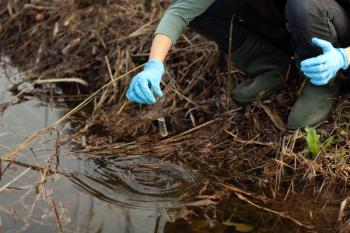 Female Biologist Working on Field Checking Mechanical Pollution of Water | Image Credit: © Fotopogledi - stock.adobe.com