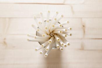 White paper straws in glass, Sustainable lifestyle concept | Image Credit: © shersor - stock.adobe.com