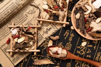 Chinese herbal medicine selection on calligraphy background | Image Credit: © zhikun sun - stock.adobe.com