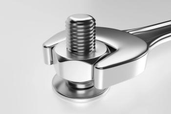 a silver wrench turns a bolt clockwise