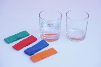 Two glass of water and colorful stripes paper. White background. Equipment prepared for doing science experiment about chromatography. Easy activity chemistry lesson for kid. | Image Credit: © Sanhanat - stock.adobe.com