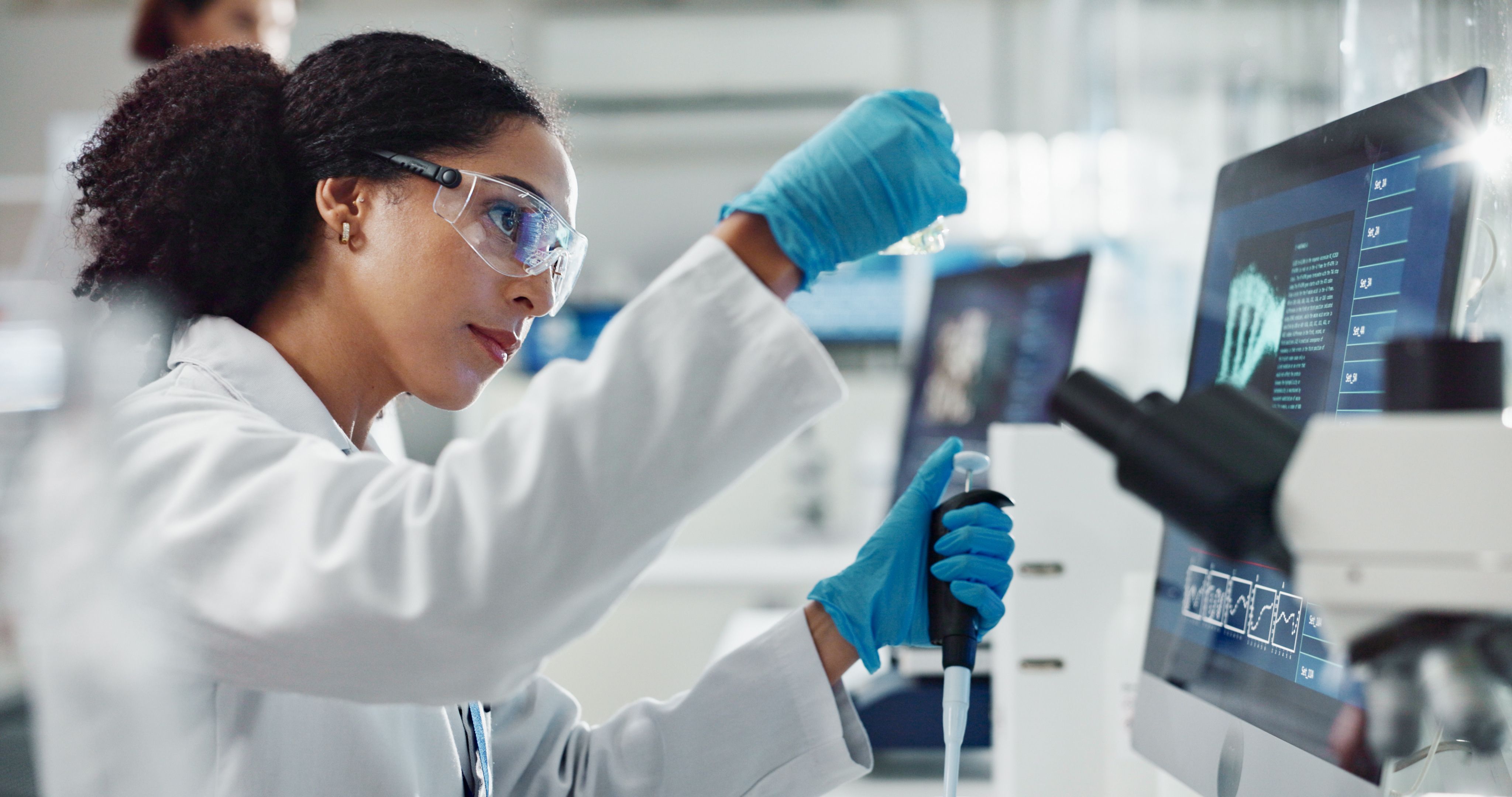 Glass vial, pipette and woman scientist in laboratory for medical study, research or experiment. Test tube, dropper and professional female person with chemical liquid for pharmaceutical innovation. | Image Credit: © HockleyMedia24/peopleimages.com - stock.adobe.com
