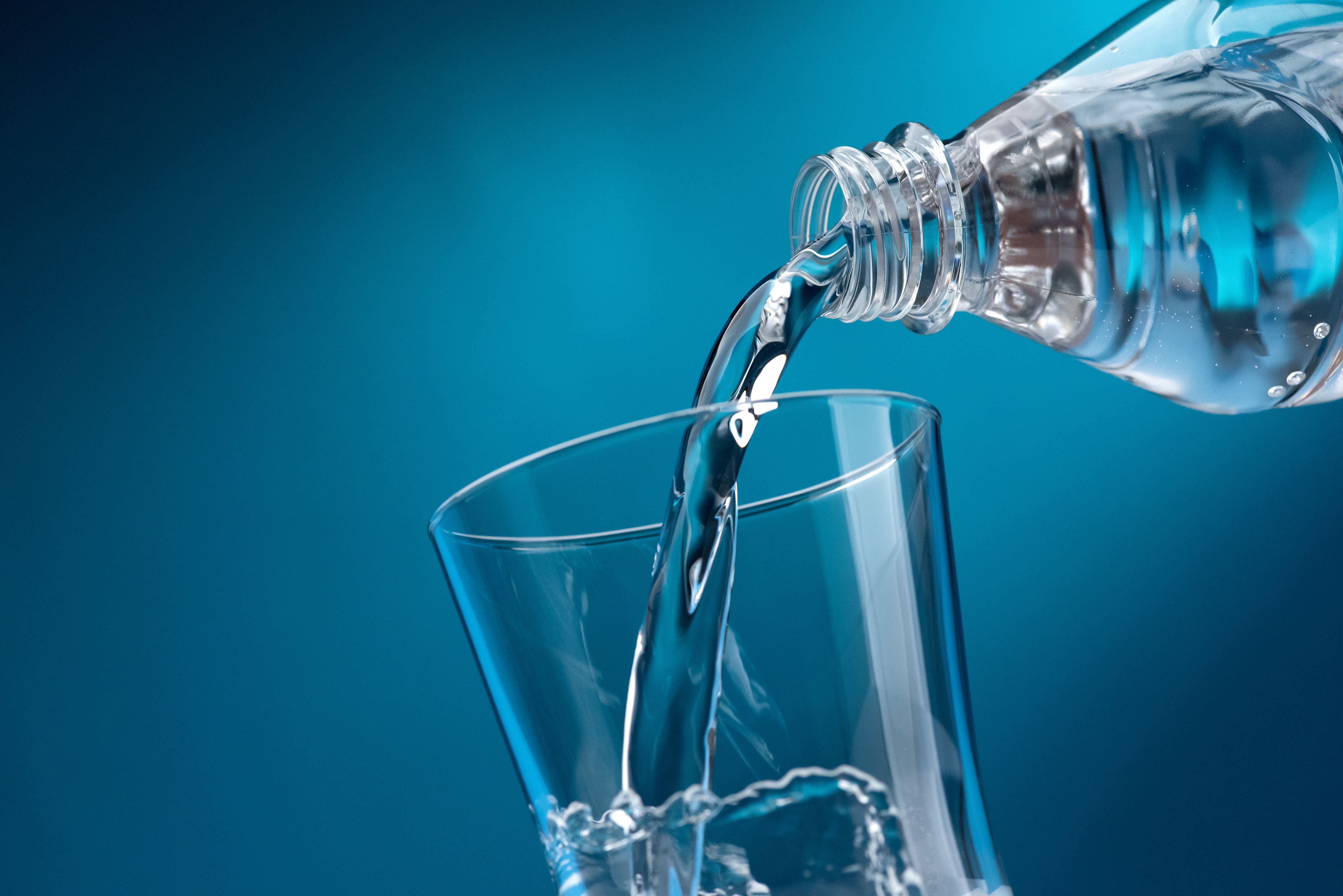 Pouring fresh water into a glass © stokkete - stock.adobe.com