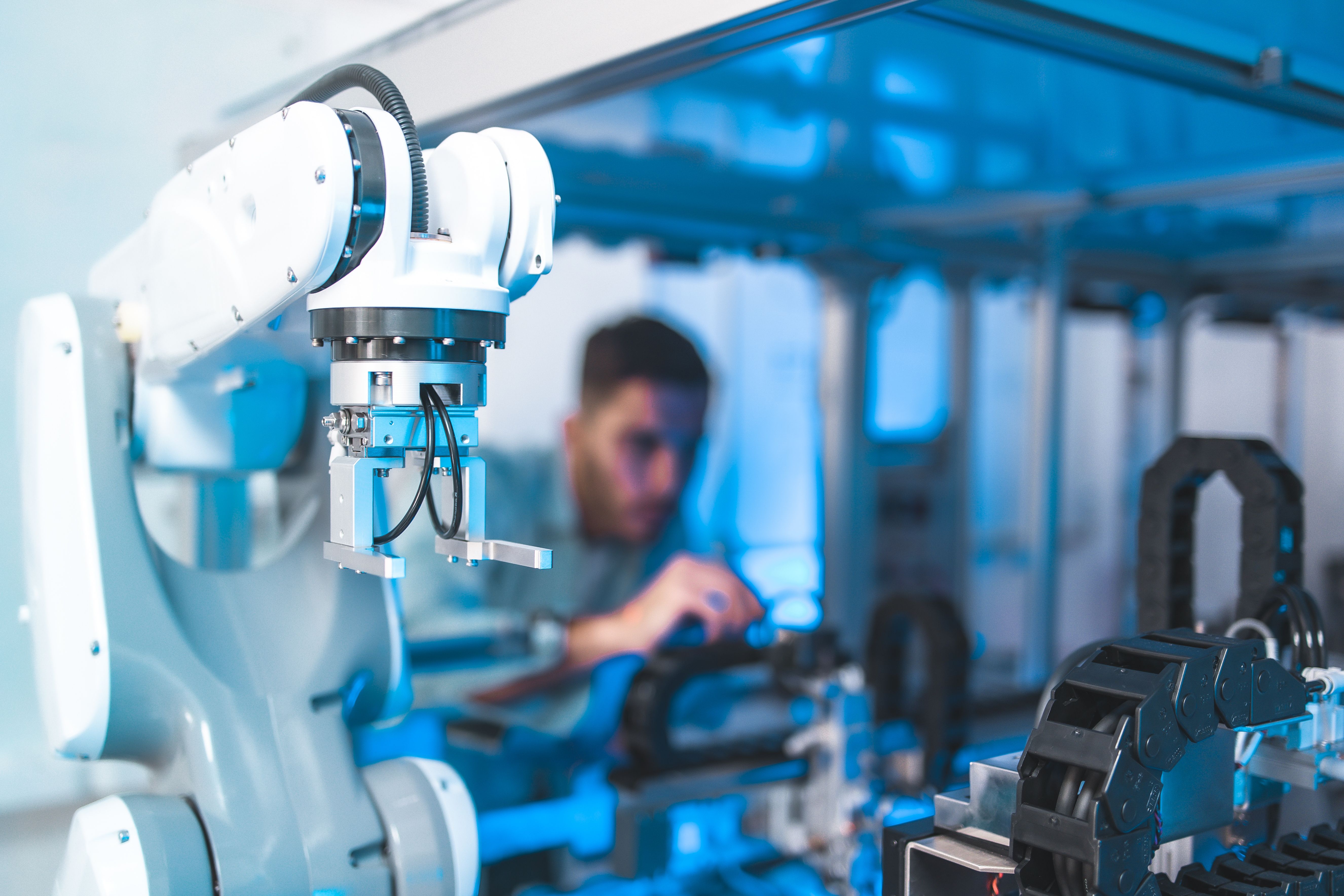 Male Engineers Maintenance Robot Arm at Lab. he are in a High Tech Research Laboratory with Modern Equipment. Technology and Innovation Concept.Professional. | Image Credit: © anon - stock.adobe.com