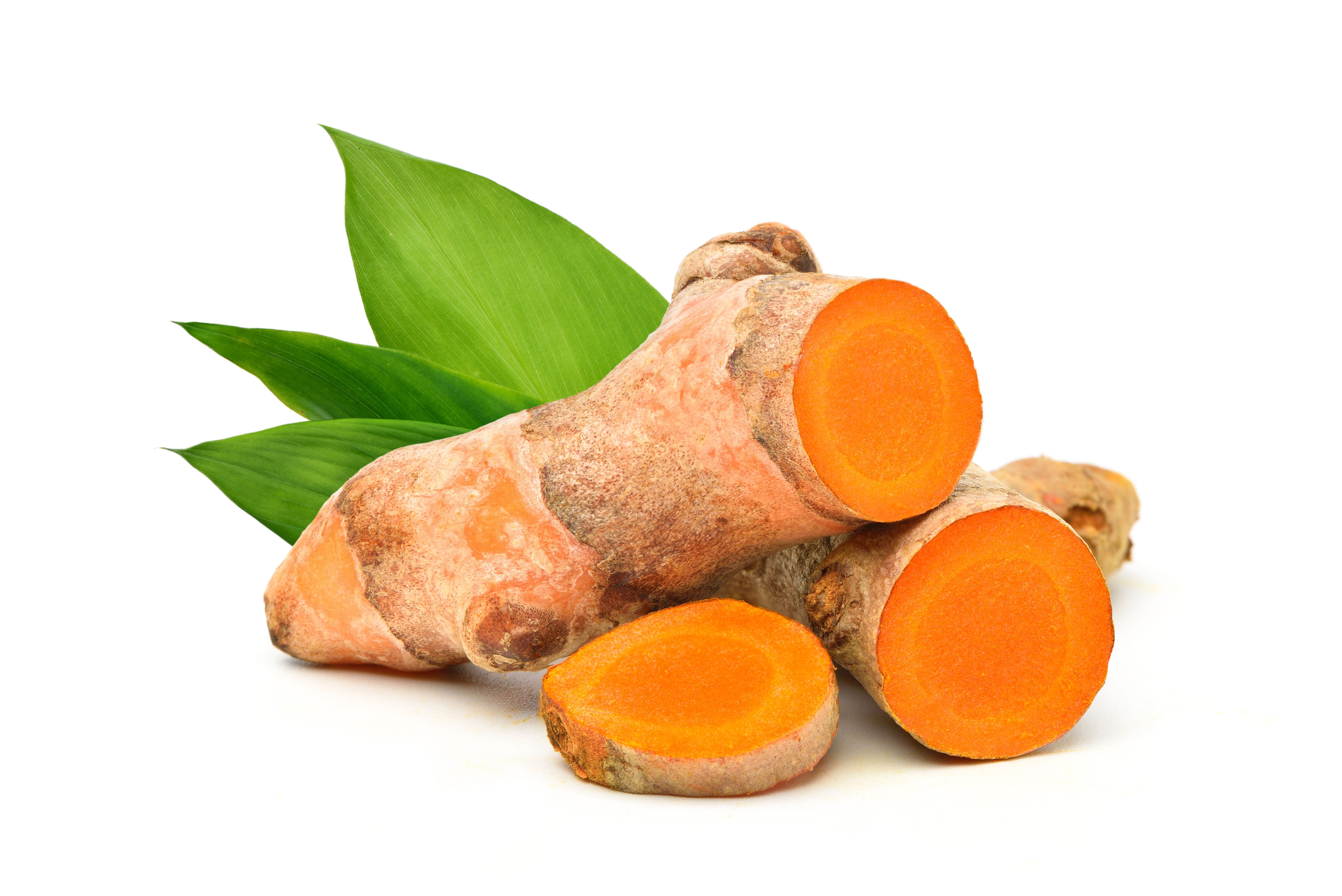 Turmeric (Curcuma longa Linn) rhizome (root) sliced with green leaves isolated on white background. | Image Credit: © Paitoon - stock.adobe.com