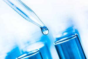 pipette against a blue background